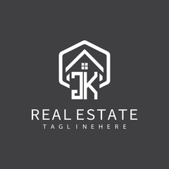 initial monogram logo for real estate with building shape creative design	
