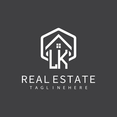 initial monogram logo for real estate with building shape creative design	
