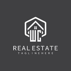 initial monogram logo for real estate with building shape creative design	
