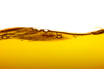 orange juice is isolated on white background. healthy fresh drink and natural waves. close up view.