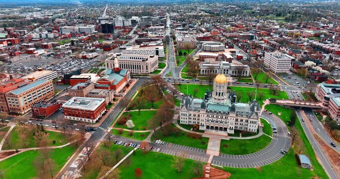Flying closer to the building of Connecticut State Capitol in Hartford, Connecticut, USA. Daytime view on the city from aerial perspective.