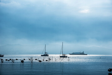 Breathtaking landscape with yachts on the sea against the background of mountains.