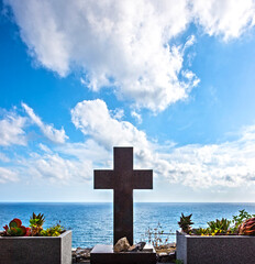 Abstract image with a cross on the background of the sea and the sky