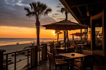 A Cozy Seaside Cafe at Dusk with Vibrant Umbrellas and a Stunning View of the Setting Sun