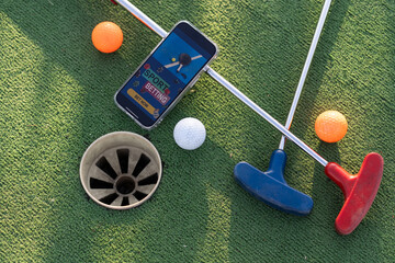 Naklejka premium mini golf sports betting on a smartphone