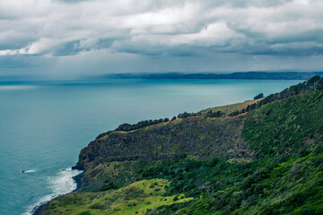 Fototapeta premium Panoramic view over Te Toto Gorge and Tasman Sea on an overcast summer day. High vantage point. Raglan, New Zealand