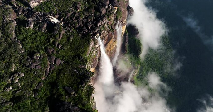 Aerial View Of Picturesque Angel Falls With Fog Clouds In Canaima National Park, Venezuela. orbiting shot