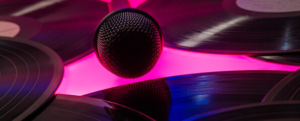 background with vinyl records and microphone