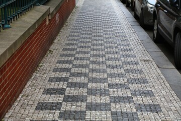 Sidewalk stone pavement patterns in Prague city