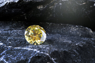 Beautiful of yellow gemstone round cut on stone, close up shot
