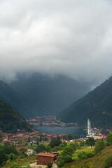 Fototapeta premium Beautiful view of Lake Uzungol and the surrounding area from the height of the mountains. One of the most beautiful tourist spots in Turkey. A popular summer vacation spot for locals and tourists.