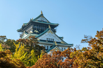 Osaka's landmark Osaka Castle castle tower that shines in the blue sky, autumn season