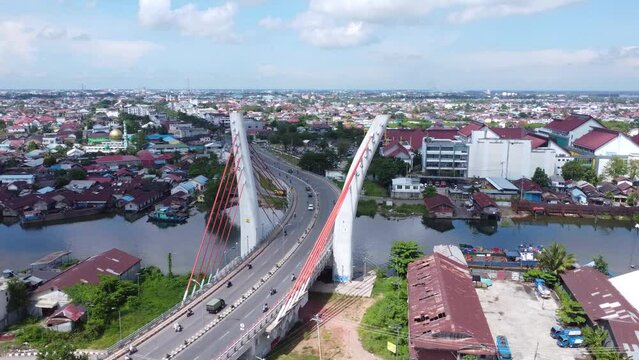 Aerial view of the Sei Alalak Bridge located in Banjarmasin which is known as the first arched bridge in Indonesia