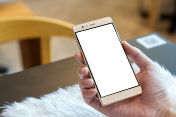 Hand holding  mobile phone with empty blank desktop screen, white screen. Mockup display smartphone.