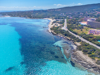Aerial view of La Pelosa beach shoreline on a sunny day