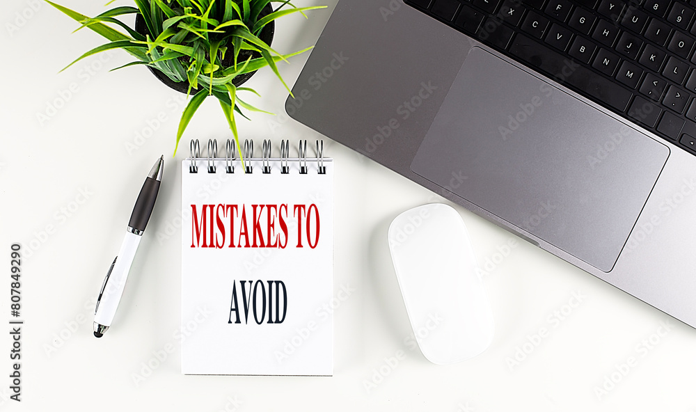 Poster mistakes to avoid text on notebook with laptop, mouse and pen
