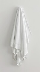 Towels hanging on a wall with a white background. Vertical background 