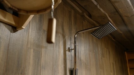 Shower without people in wooden style. Shower in the sauna. Shower close-up. Shower in a sauna...