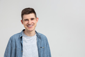 Young smiling happy handsome man wearing casual shirt