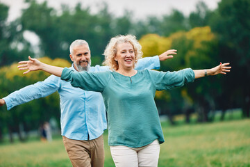 woman man couple happy together mature active balance walk balancing challenge step exercise...