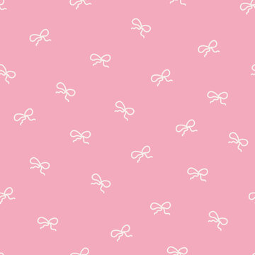 Tiny coquette bows on a pink background - seamless pattern design