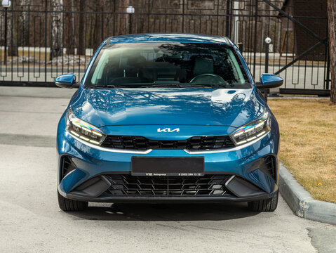 Novosibirsk, Russia -  April 30  , 2024: Kia K3 ,  front   view, parked of a city. No other car and people.