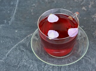 Cup of herbal infusion from Cistus incanus, known as rock rose. Traditional curative herbal tea...