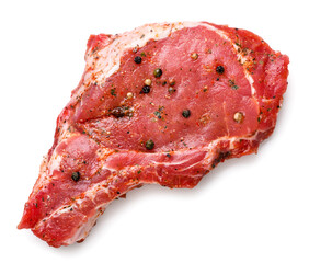 Pork loin with seasonings on a white background. Raw meat isolated, top view