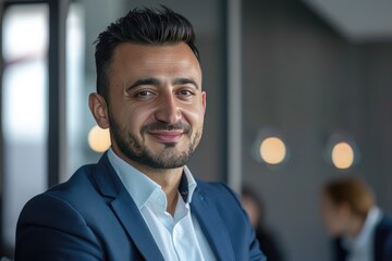 Fototapeta premium Businessman talking to colleagues during meeting in office. Business people having conversation at workplace. Teamwork concept