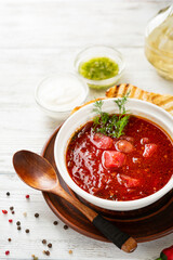 borscht in a white bowl soup food on light wood