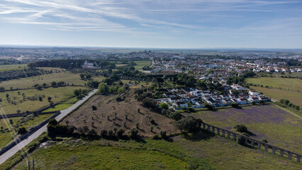 Évora, Alentejo, Portugal. May 7, 2024. Aerial view of Évora, Portugal, showcasing the historic Água de Prata Aqueduct stretching across the cityscape. 