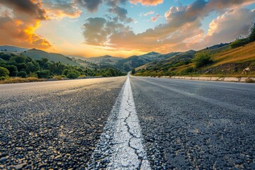 Captivating shot of an empty weathered road stretching towards a dramatic sunset horizon under a cloud-filled sky. Beautiful simple AI generated image in 4K, unique.