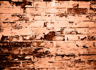 Brick wall background. Peach fuzz is color of year 2024.