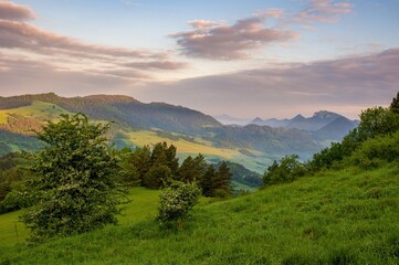 Mountain pass in Pieniny in Poland. Beautiful, dynamic and hazy sky over the mountains. Slovakia and Poland countryside.Mountain hiking, healthy lifestyle. Spring Poland.