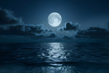 Full moon illuminating the ocean with its silvery light under a starry night sky