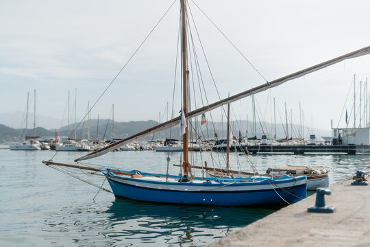 Tranquil Sailing: La Spezia Harbor with Majestic Mountain Backdrop