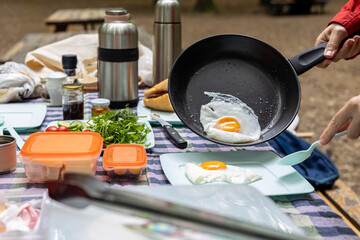English breakfast with eggs on outdoor camping