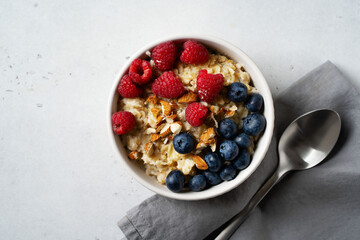 Porridge with berries, blueberry and raspberry and almond nuts