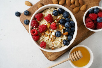 Porridge with berries, blueberry and raspberry and almond nuts