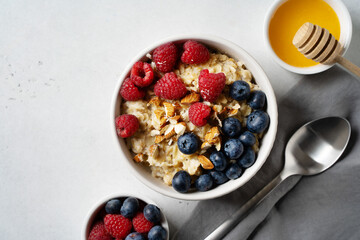 Porridge with berries, blueberry and raspberry and almond nuts