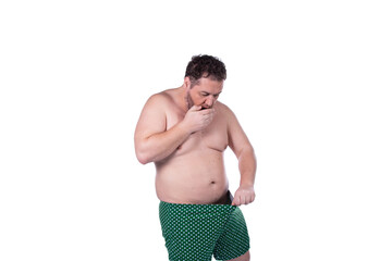 Men's health and erection problems. Fat man posing on a white background.
