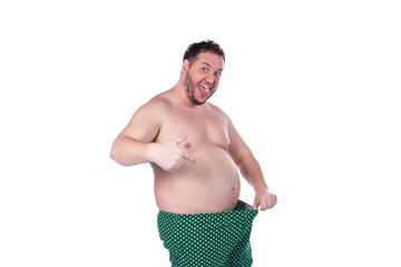 Men's health and erection problems. Fat man posing on a white background.