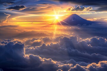 雲の上に頭を出した富士山と日の出・朝日