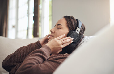 Home, relax and woman with headphones, listening to music and sound with online, audio or radio....