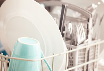 Clean, closeup and dishes or dishwasher in kitchen with plate, cup and cutlery for hygiene and...