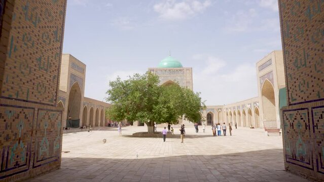 View of Kalan Minaret Emir and Alim Khan madrasah of Po-i-Kalan (Poi Kalan) - islamic religious complex Bukhara, Uzbekistan