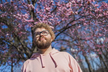 Man allergic enjoying after treatment from seasonal allergy at spring. Portrait of happy bearded...