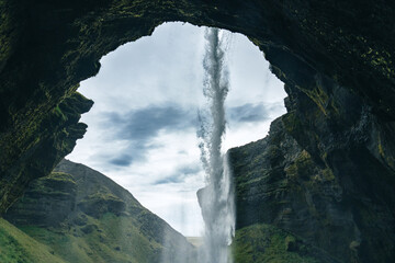 Kvernufoss waterfall, Suðurland region, southern part of Iceland. Hidden gem, gush of water falls...