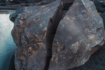 Huge rock split in two. Large broken boulder. Volcanic activity, force of nature.