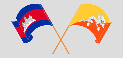 Crossed and waving flags of Cambodia and Bhutan